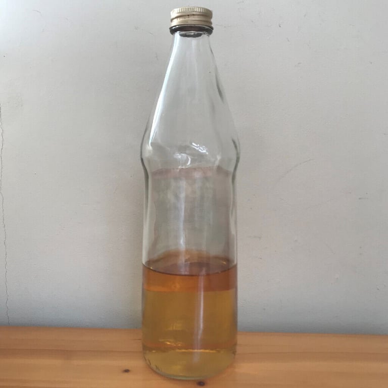 Vintage Corona Peppermint Cordial glass bottle + some contents.
