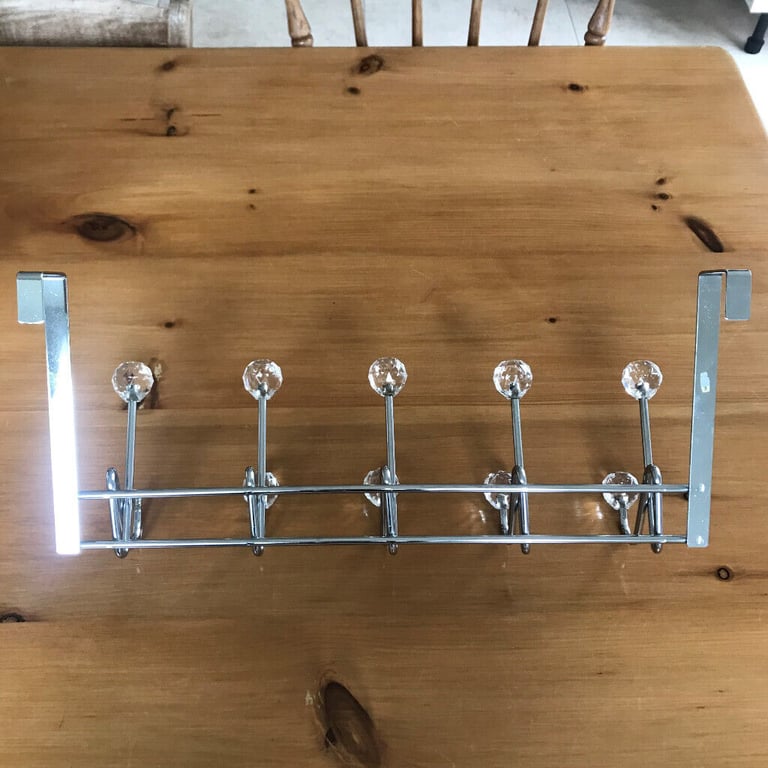 Jewelled over-door hooks - 10, chrome(d), multi-faceted glass effect finials, one missing. £4 ovno.
