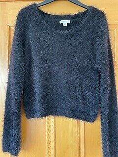 Black short fluffy jumper size M from Topshop in good condition