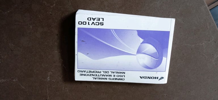 Honda SCV 100 Scooter owners manual.