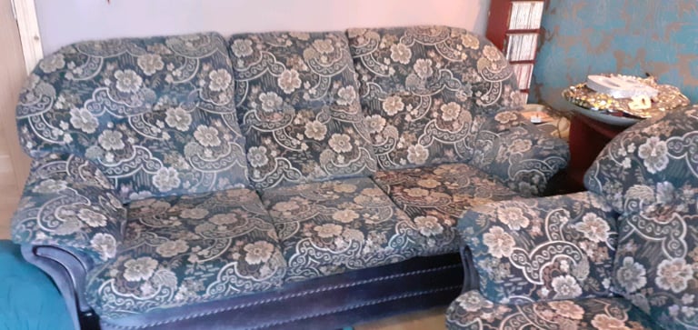Blue 3 seater velvet sofa with a matching foot stool 
