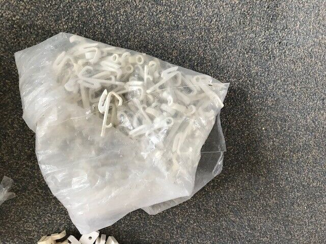 A collection of white curtain tracks and fittings[or separate]