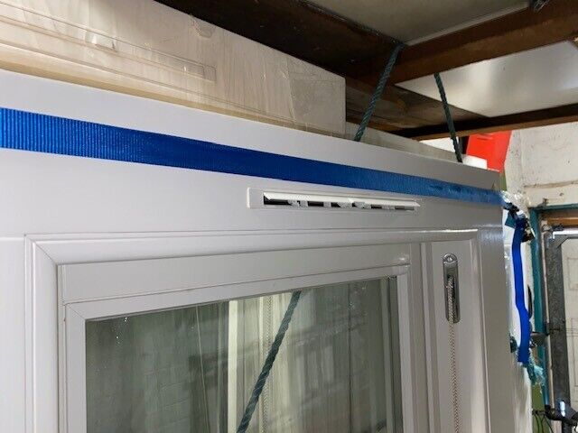 Traditional wooden sash window with key
