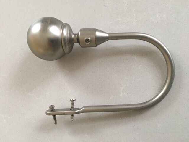 Decorative curtain tie-backs in brushed steel finish