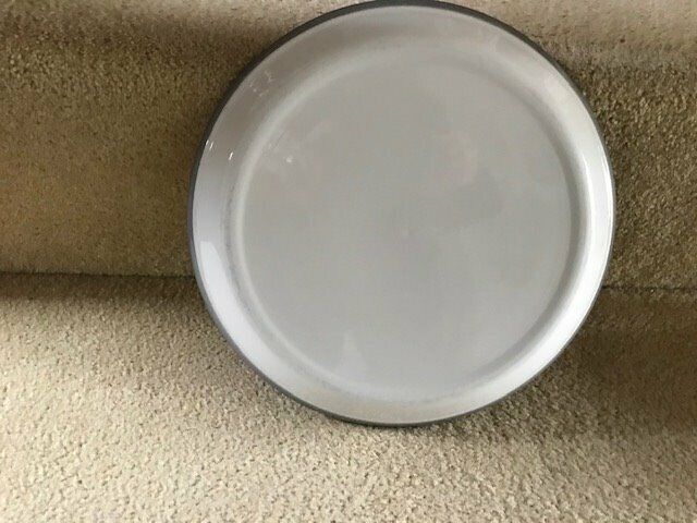 Several items of crockery with pink and grey design