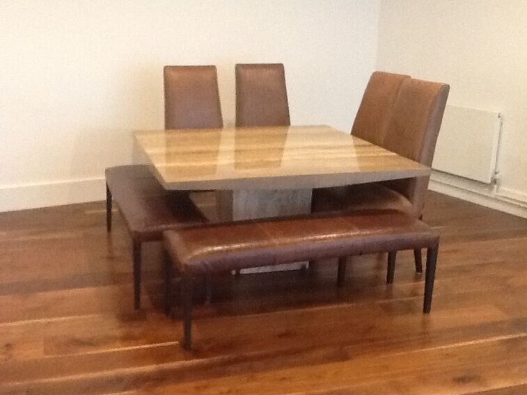 large bespoke marble table with large leather benches and chairs
