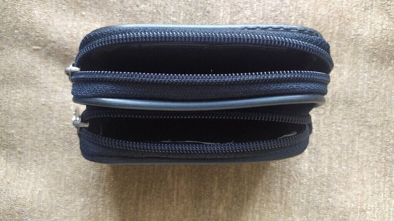 Small, black,good quality leather pouch. New.With loop for belt.