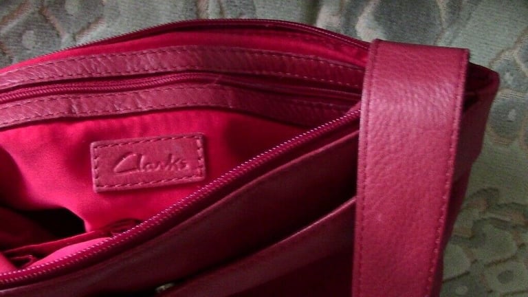 A leather bag of cherry colour, Clarks, in a good condition, £ 10   