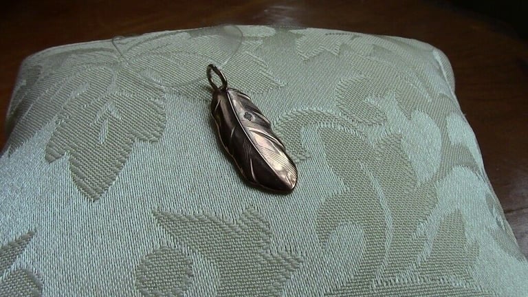 Brand new silver pendant, gilded and with one small diamond, in the shape of a leaf£ 15