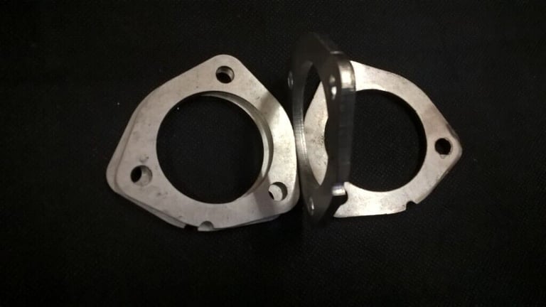 Four Stainless Steel Exhaust Flanges.  