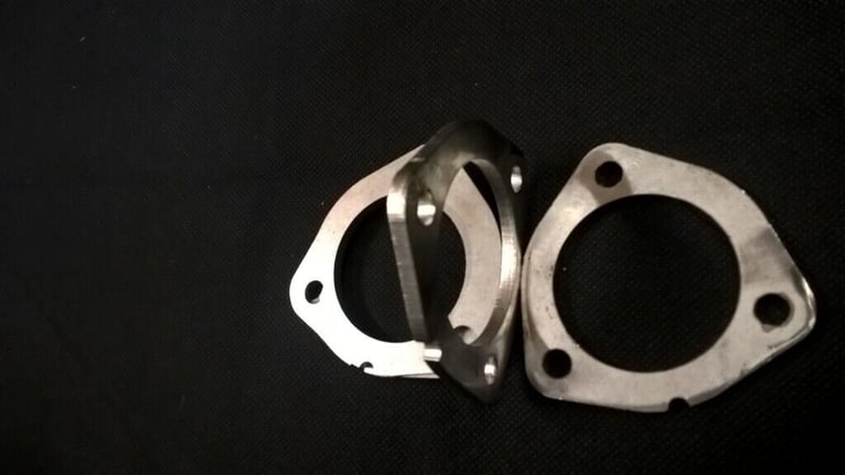 Four Stainless Steel Exhaust Flanges.  