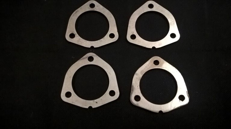 Four Stainless Steel Exhaust Flanges.  