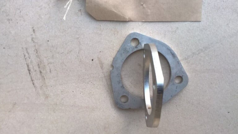 Four Stainless Steel Exhaust Flanges.  
