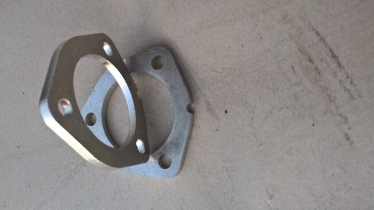 Four Stainless Steel Exhaust Flanges.  
