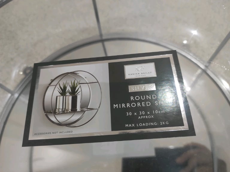 Round mirrored shelf