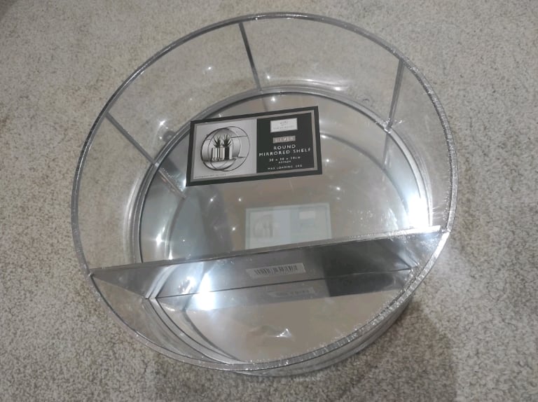 Round mirrored shelf