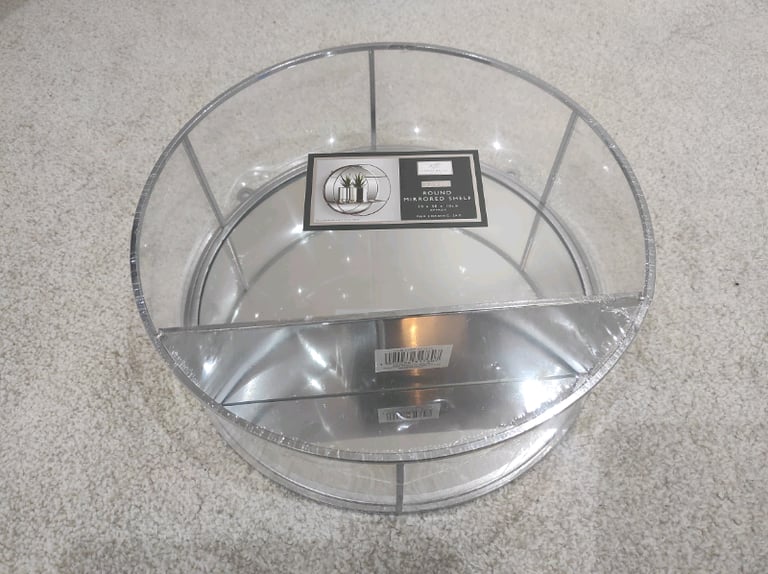 Round mirrored shelf