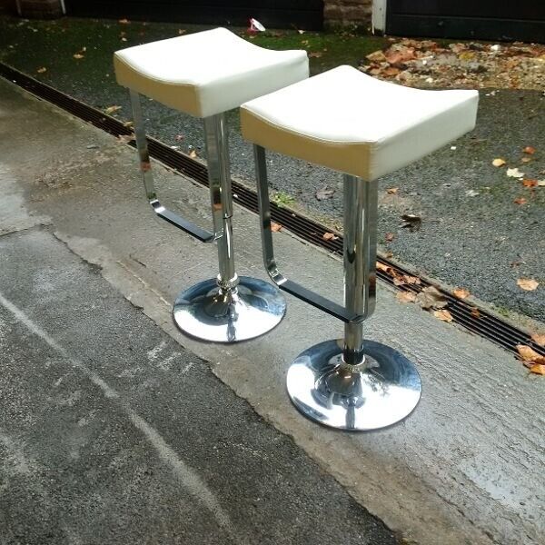 two elegant adjustable leather bar stools can deliver