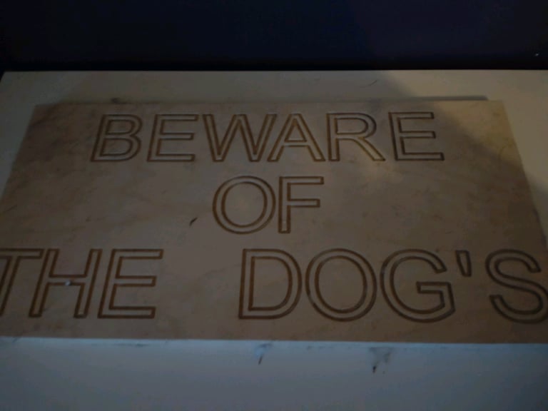 Wooden dog sign