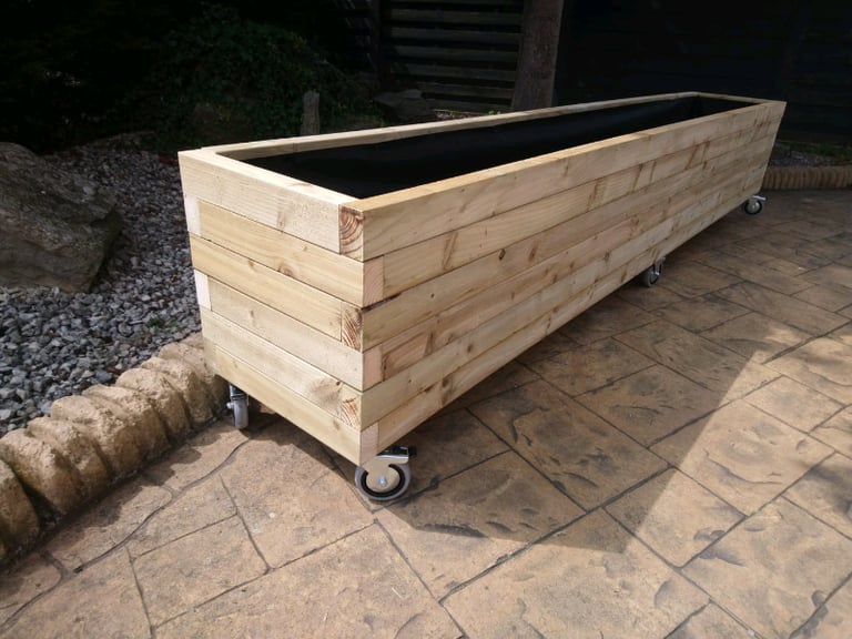 Custom made planters on heavy duty castors
