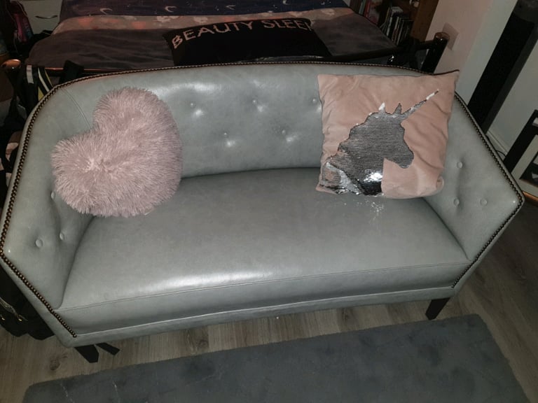 Gray leather love seat 