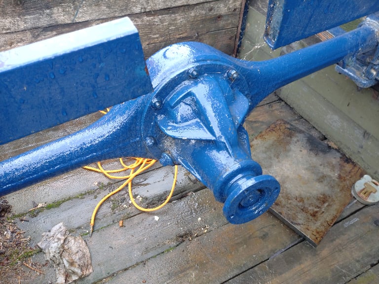 Box trailer frame with early mini type axle.