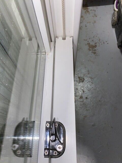 Traditional wooden sash window with key