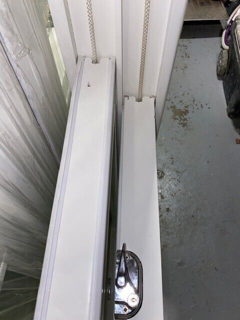 Traditional wooden sash window with key
