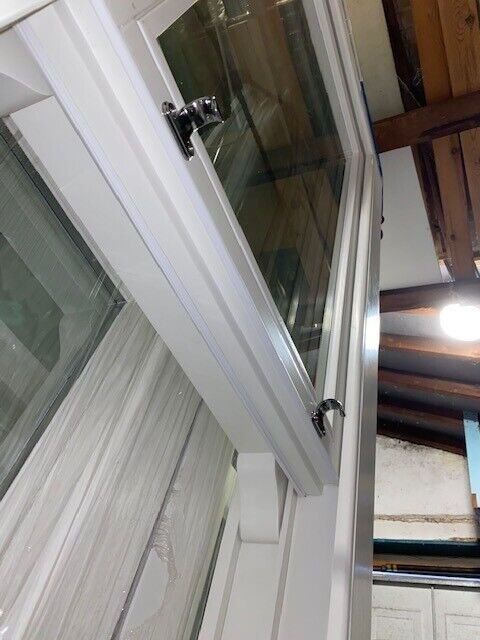 Traditional wooden sash window with key