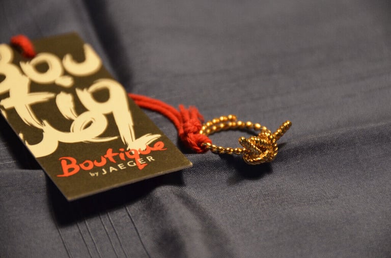 image for Jaeger 'Boutique' gold knotted-bow rope design ring. Adjustable size. Brand new, unworn.