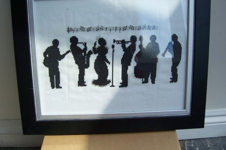 image for 2 Silhouettes in black showing band and trumpet 🎺 