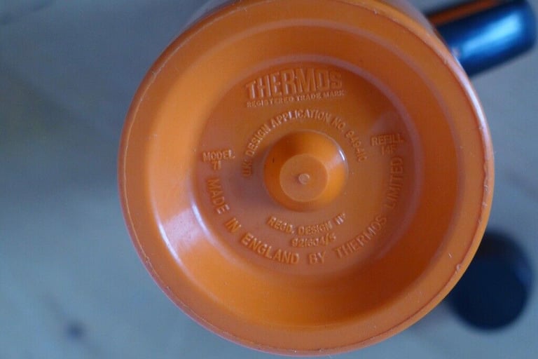 Kitchenalia: Vintage 1950s/1960s Jug-shaped Thermos Flask in Orange and black.