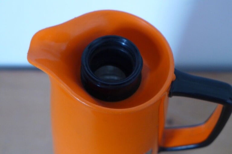 Kitchenalia: Vintage 1950s/1960s Jug-shaped Thermos Flask in Orange and black.
