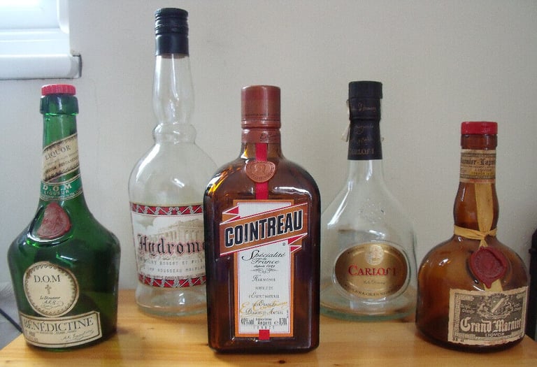 4 empty spirit bottles: Hydromel, Carlos I,Cointreau,Benedictine.Grand Marnier SOLD! £1.50 ea
