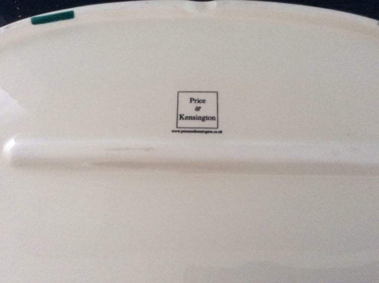 Bread bin with Price and Kensington marked on the base.