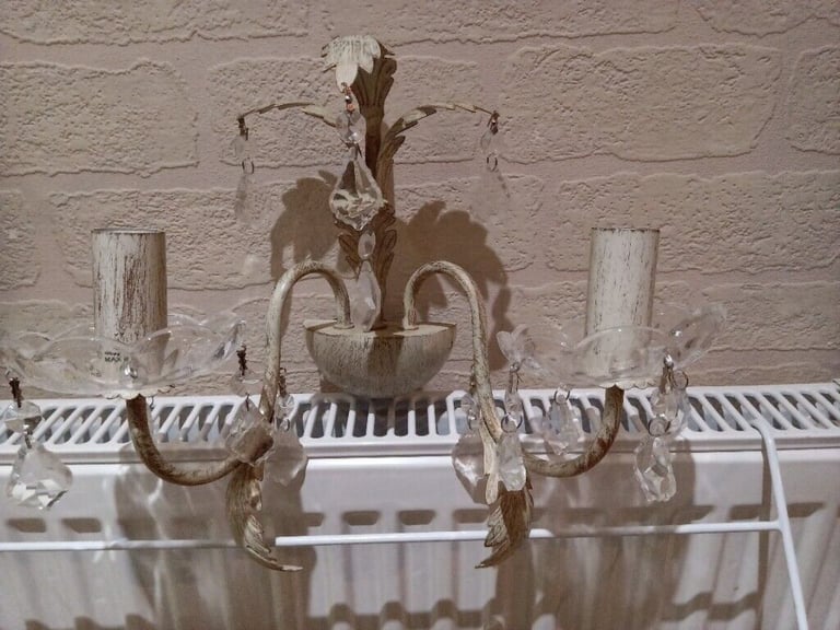 A pair of beautiful twin cream/gold wall lights with crystal droplets 