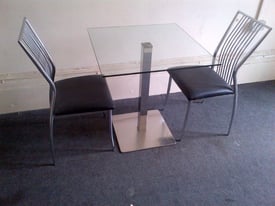 image for modern glass table with three chairs can deliver