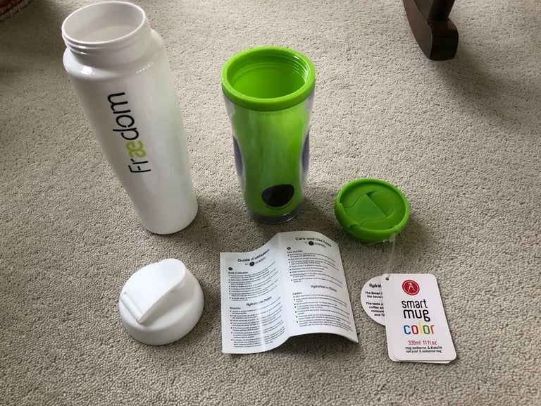 A Smart Travel Mug, White water bottle, Marks & Spencer pouch bag.