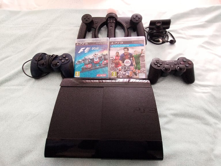 SONY PS3, move controller, 2 joysticks, 2 games and PS webcam.