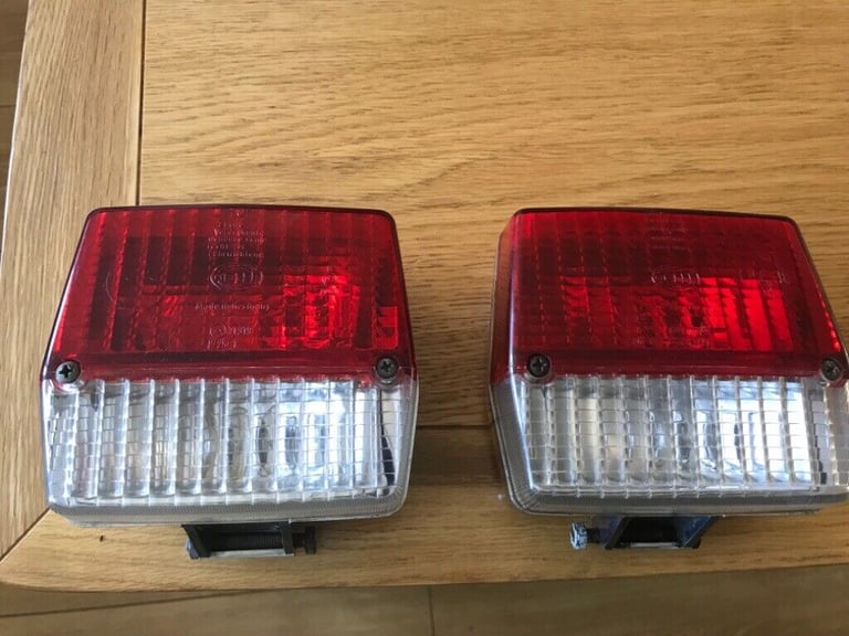 Two chrome trailer lights Hella.