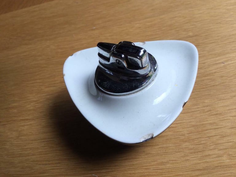 Vintage 1960’s working lighter in a stylish ceramic dish.