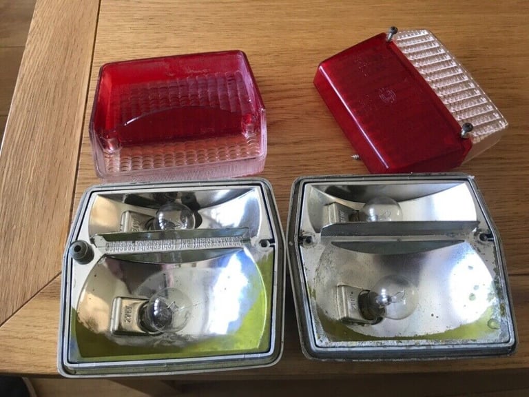 Two chrome trailer lights Hella.
