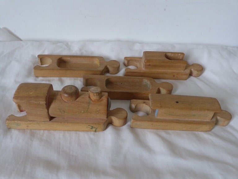 UNUSUAL VINTAGE WOODEN TOY TRAIN. With pieces designed to fit together like a jigsaw puzzle. 