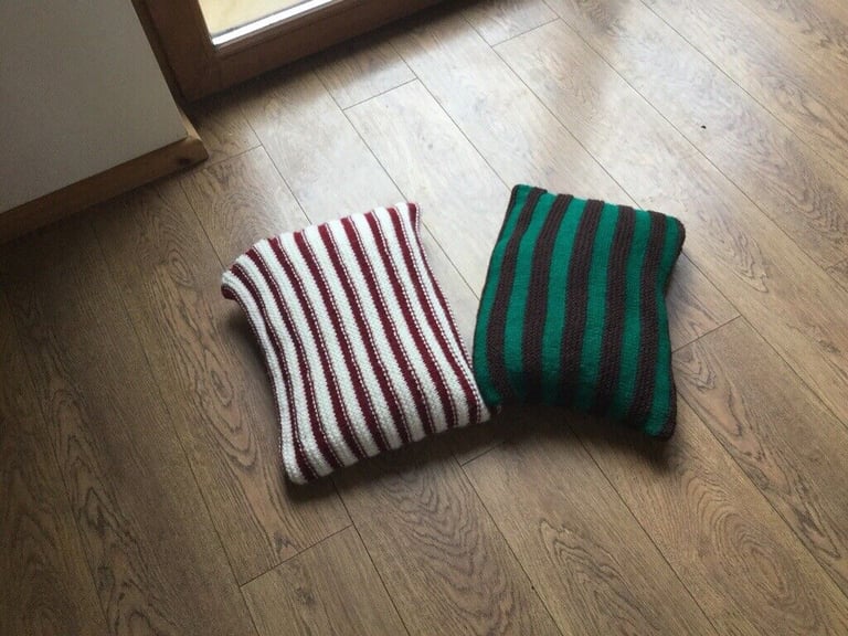 TWO HANDCRAFTED CUSHIONS.