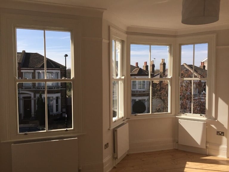 Traditional wooden sash window with key