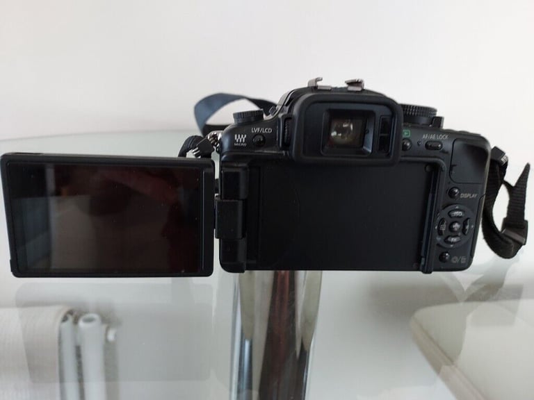Panasonic Lumix DMC-G1 12.1MP Digital Camera with Lumix G Vario 14-45mm/F3.5-5.6 Lens and filters