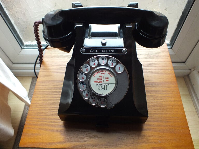 Vintage 1950s GPO bakelite dial phone with 'call exchange' button