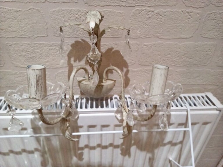 A pair of beautiful twin cream/gold wall lights with crystal droplets 