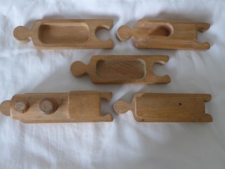 UNUSUAL VINTAGE WOODEN TOY TRAIN. With pieces designed to fit together like a jigsaw puzzle. 