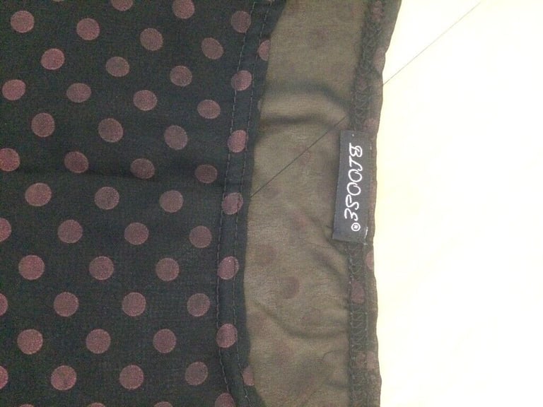 Attractive polka dot top size 12/14 unworn